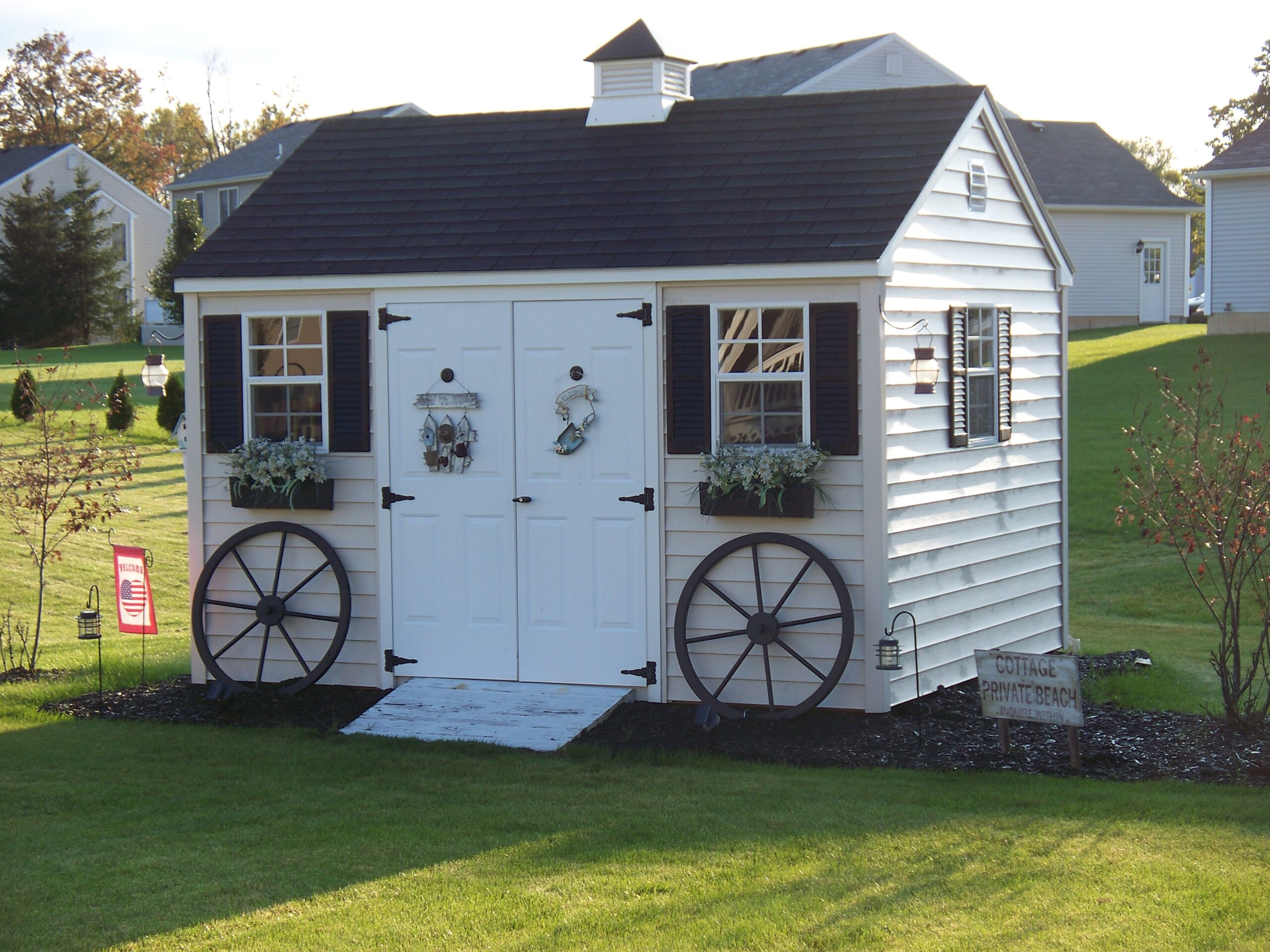 A small cottage-style shed with rustic decorations and touches