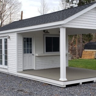 12 x 24 Pool house with open deck, a sliding window for easy access to interior space, French doors lead to finished interior space.